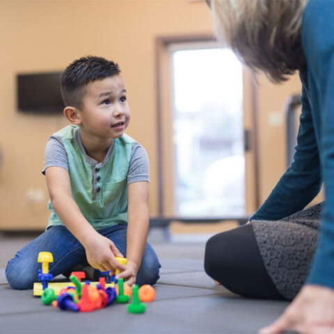 adult and child in school