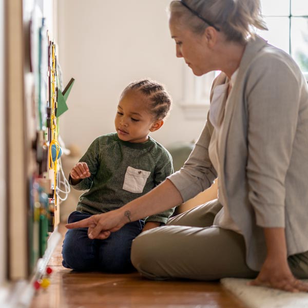 teacher helping young student