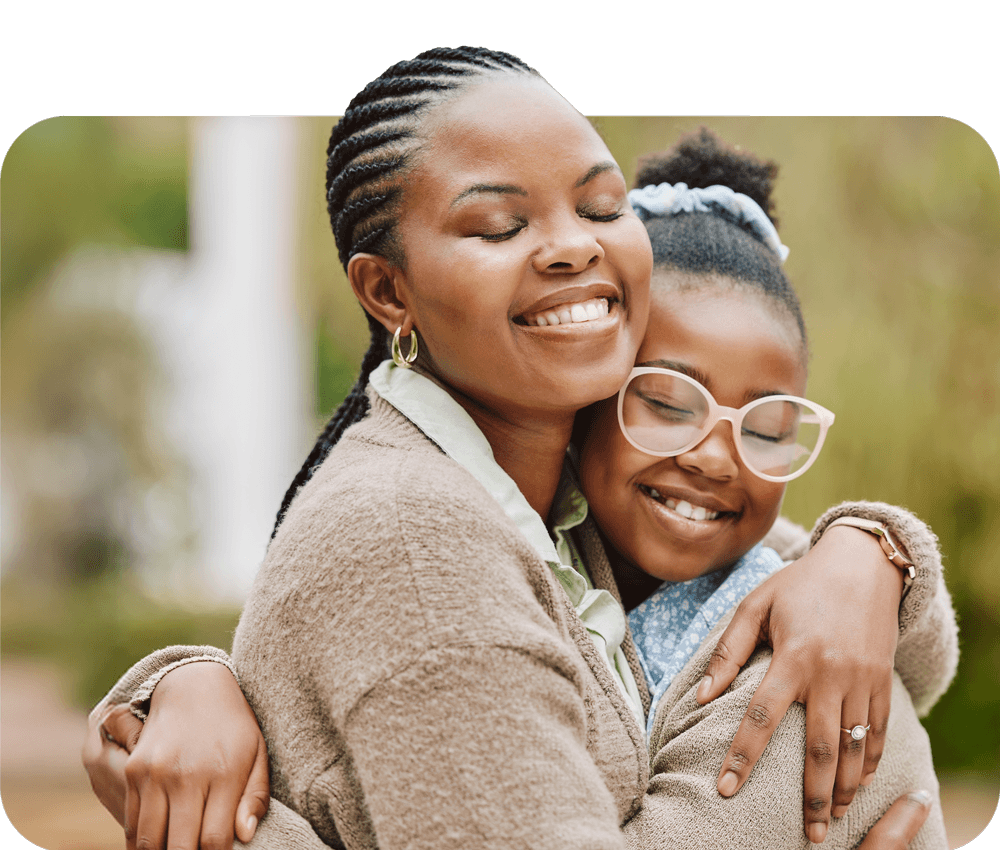 mother hugging daughter
